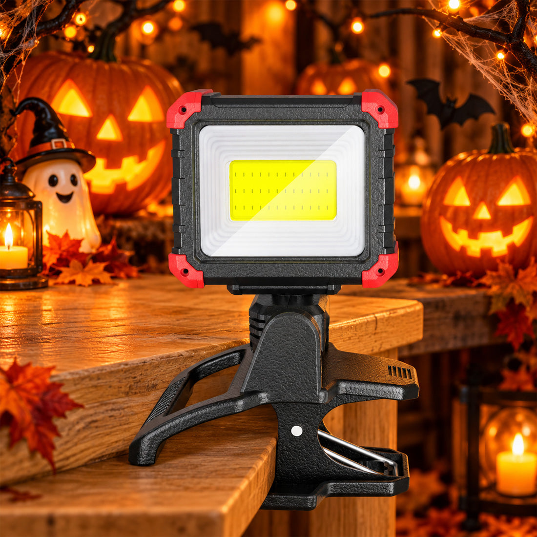 Hokolite COB LED work light with clamp mount displayed among glowing Halloween pumpkins