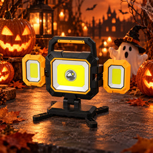 Hokolite portable triple-panel LED work light with folding side lights in a Halloween setting